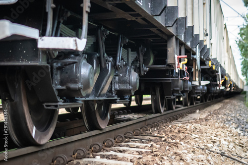 Wheels of cargo train on a rail track