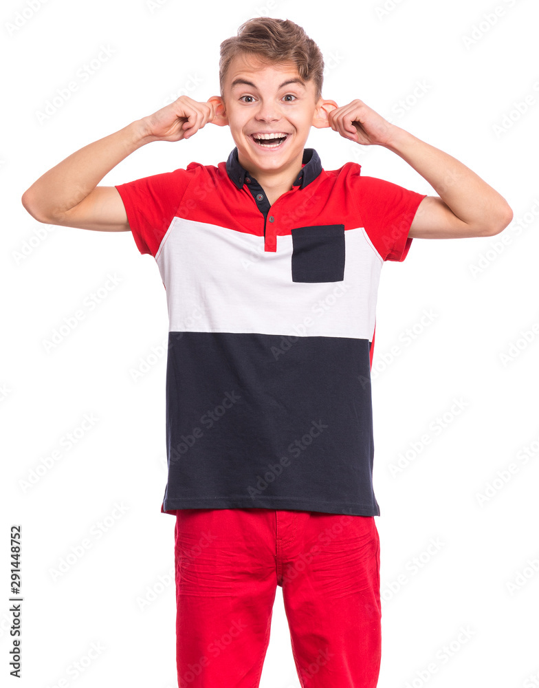 Silly teen boy making grimace - funny monkey face. Child with big ears, isolated on white background. Emotional portrait of teenager looking at camera. Attractive boy stretching ears imitating monkey. Silly teen boy making grimace - funny monkey face. Child with big ears, isolated on white background. Emotional portrait of teenager looking at camera. Attractive boy stretching ears imitating monkey.