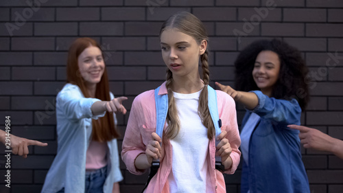 Εκτύπωση καμβά Female peers pointing fingers desperate schoolgirl, college teasing condemnation