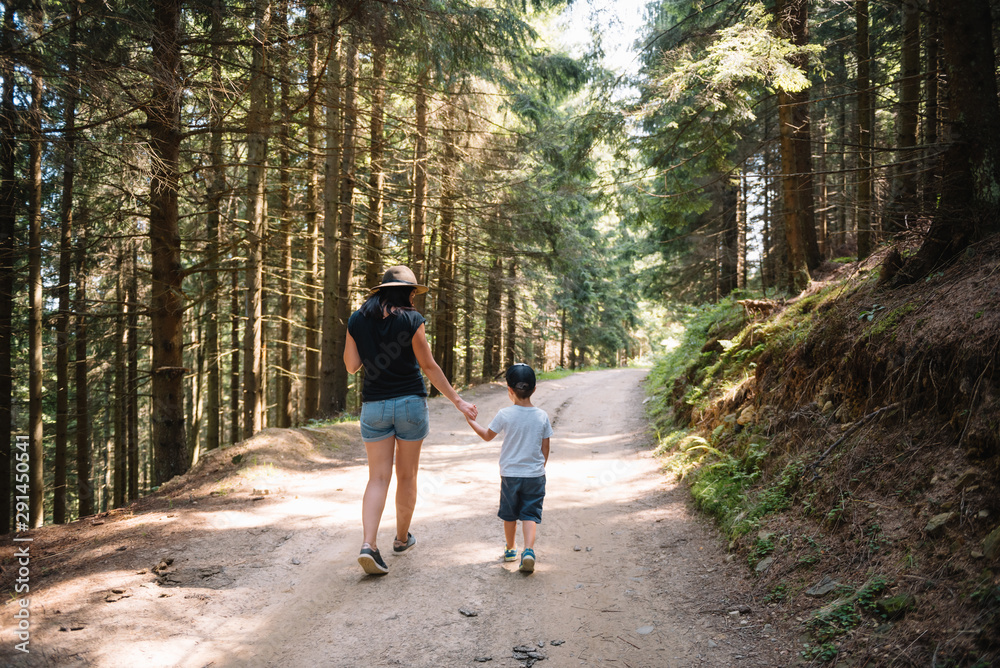 mother and son having rest on vacation in mountains mother and son having rest on vacation in mountains