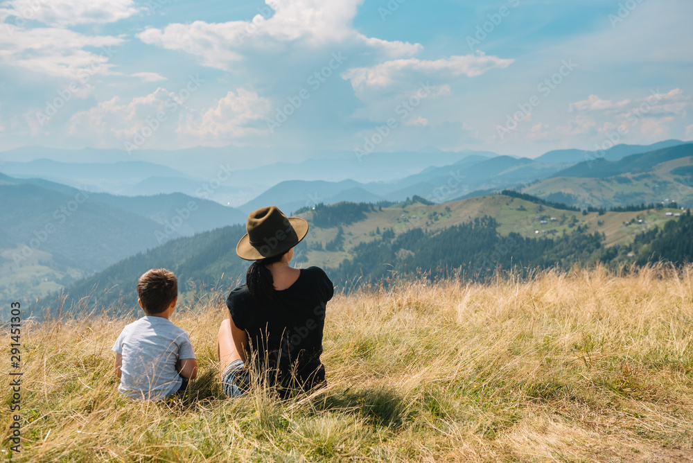Fototapeta premium mother and son having rest on vacation in mountains