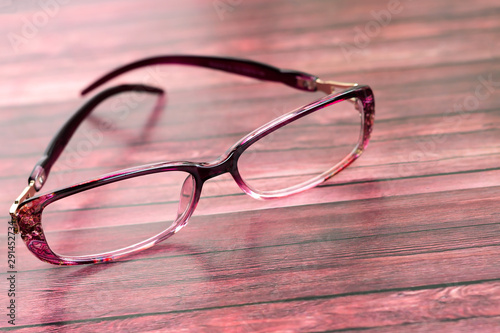On the surface are stylish women's glasses for vision