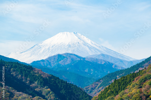 Majestic mount Fuji with foreground of montains and forest. Copy space on top.