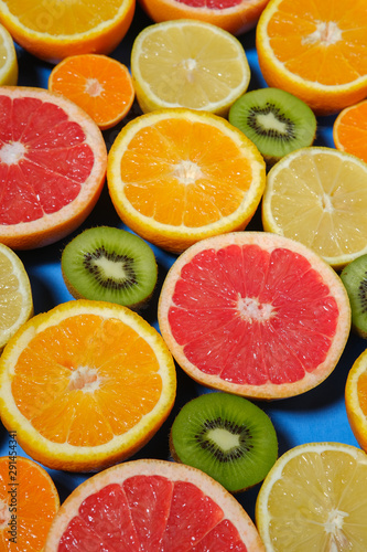 Orange, grapefruit, kiwi sliced and slices. 