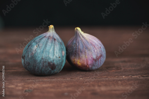 Fig fruits. Still life of figs on a dark wooden table.