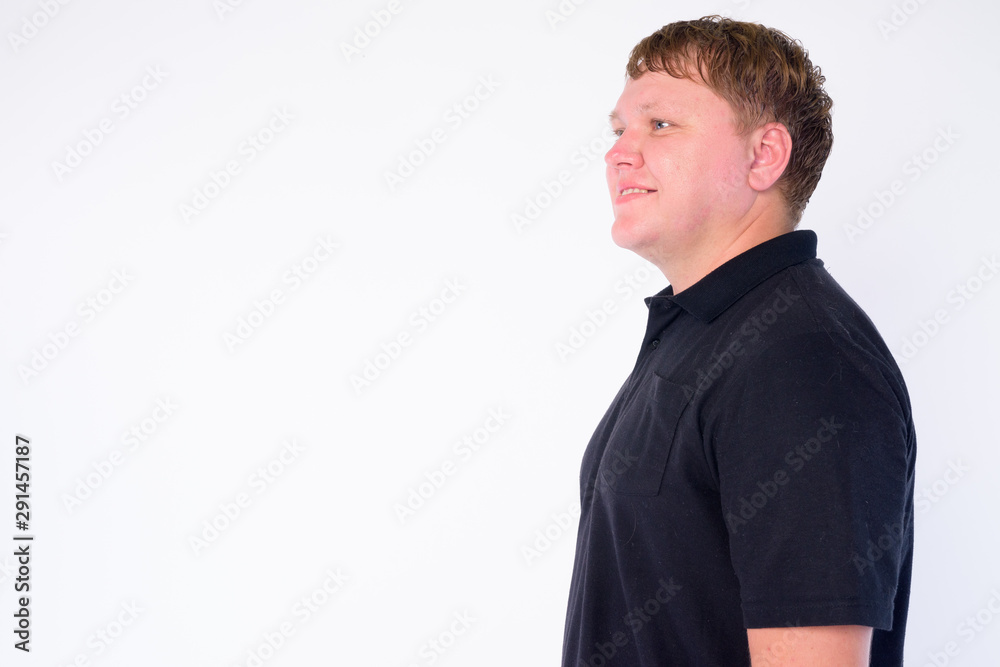 Profile view of happy overweight man smiling Profile view of happy overweight man smiling