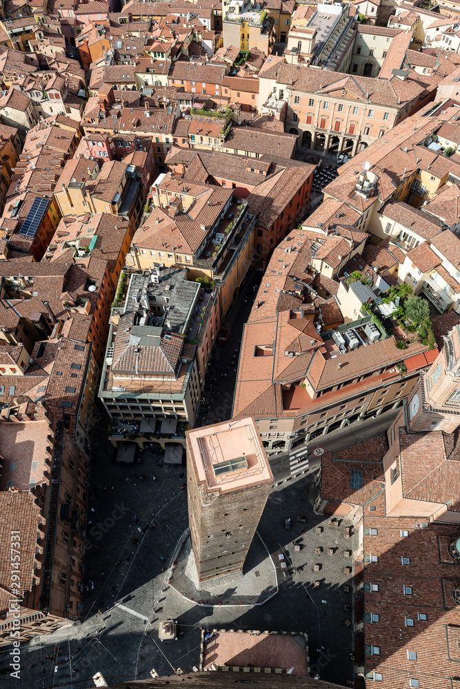 View from atop Asinelli Tower looking down upon Garisenda Tower. Better know as the Two Towers of Bologna. Italy.