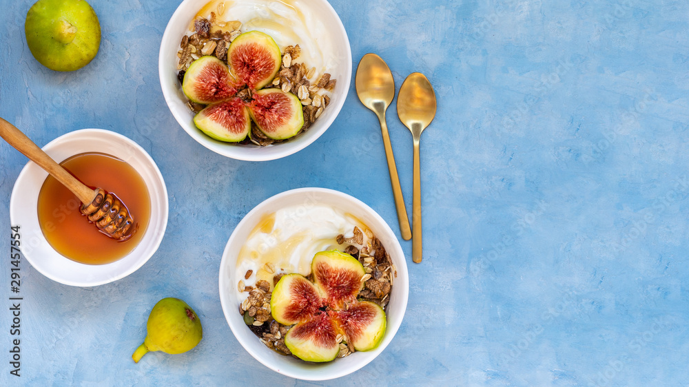 Breakfast with muesli, yogurt, figs in a bowl Breakfast with muesli, yogurt, figs in a bowl