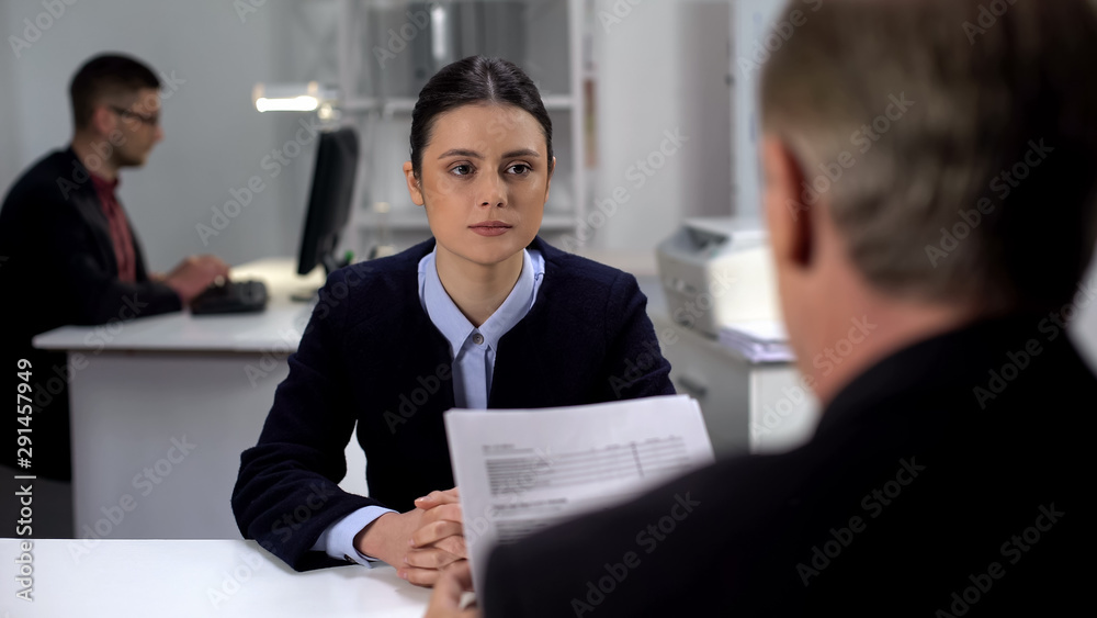 Boss checking female employee work results, probationary period at workplace Boss checking female employee work results, probationary period at workplace