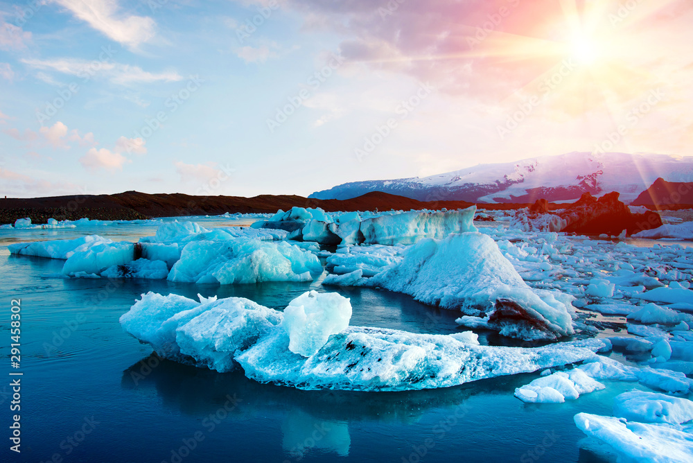 Magical view with ice depths in the famous Jokulsarlon glacial lagoon in Iceland at sunset. Exotic countries. Amazing places. Popular tourist atraction. (global warming – concept)