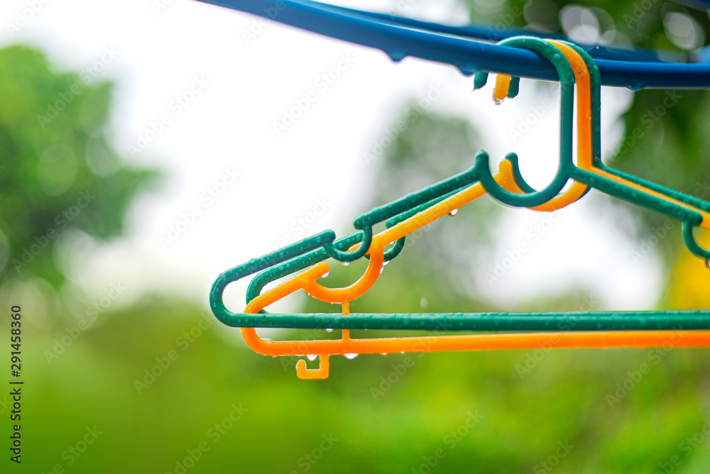 Hanger on the clothesline in outdoor and raining Hanger on the clothesline in outdoor and raining