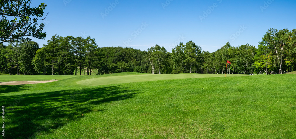 Panorama View of Golf Course with beautiful putting green. Golf course with a rich green turf beautiful scenery.