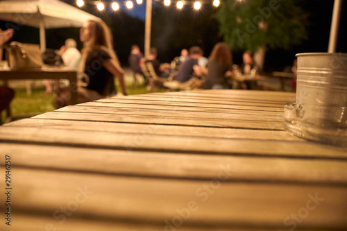 view of a wooden table on the terrace of a bar © luismicss
