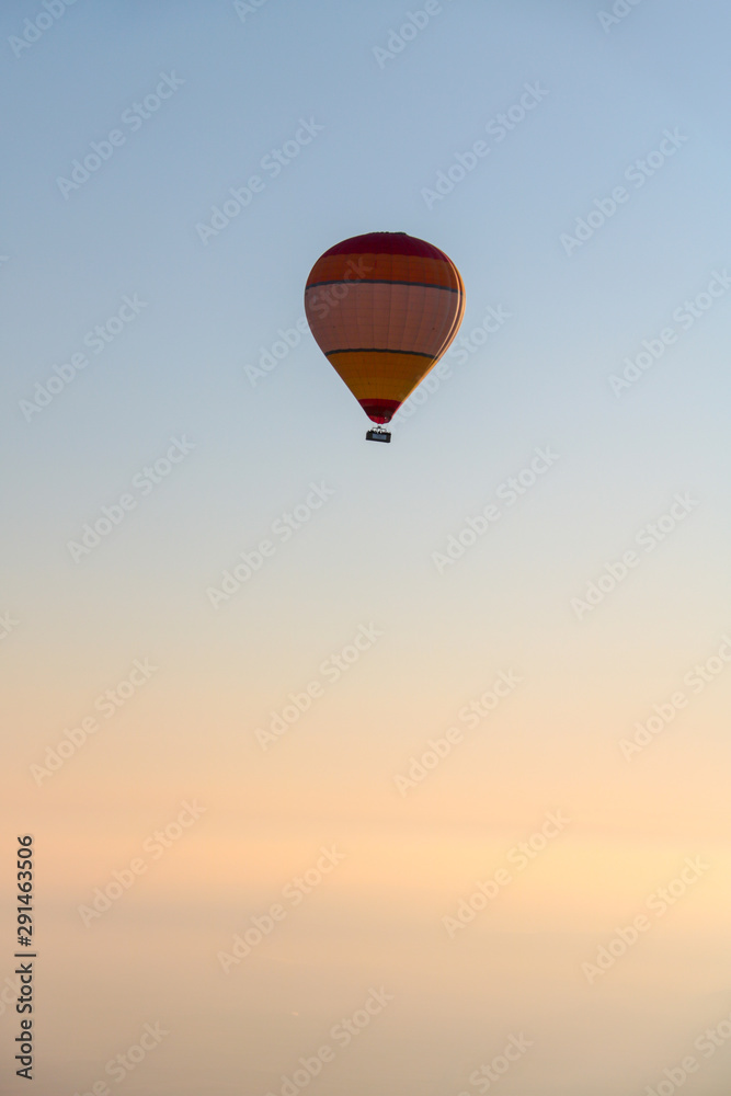 colorful hot air balloon isolated on the sky at sunrise colorful hot air balloon isolated on the sky at sunrise