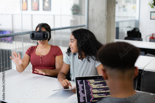 High school students using VR headset in class