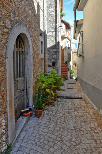 The small square of an old mountain town. the buildings are built in a traditional architectural style