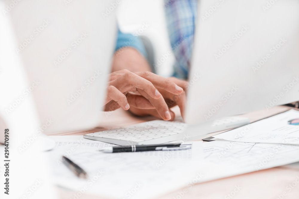 close up. background image of employees typing on the computer keyboard close up. background image of employees typing on the computer keyboard