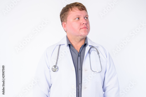 Face of overweight man doctor thinking and looking up