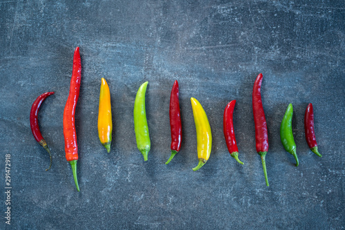 chili peppers, different colors and shape. yellow, orange, green and red peppers