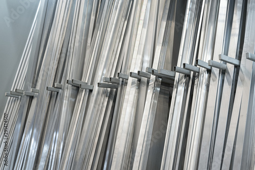 Metal profiles on a construction store counter background.