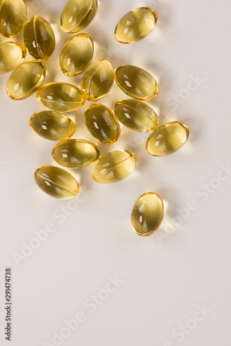 Fish oil capsules, rich in Omega 3. Closeup, isolated on white background.