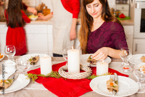 Woman prepare table to selebration of Christmas holiday