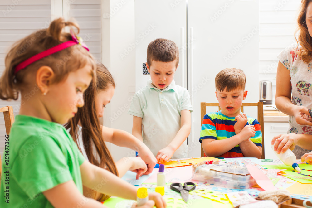 Fototapeta premium Children attend masterclass and do postcards together