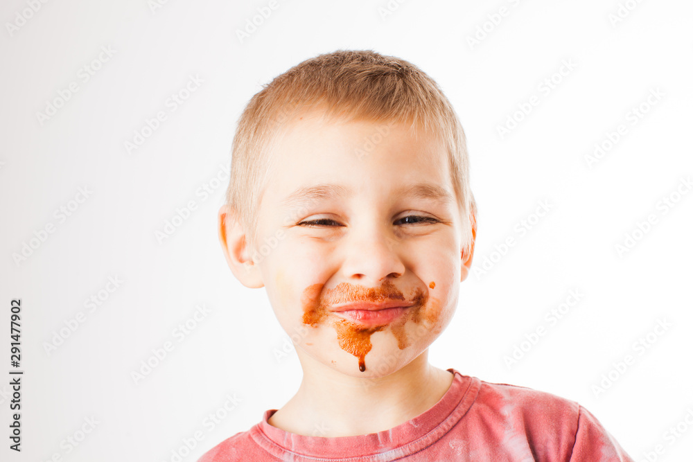 Portrait of fair-haired boy with chocolate on his face isolated on white Portrait of fair-haired boy with chocolate on his face isolated on white
