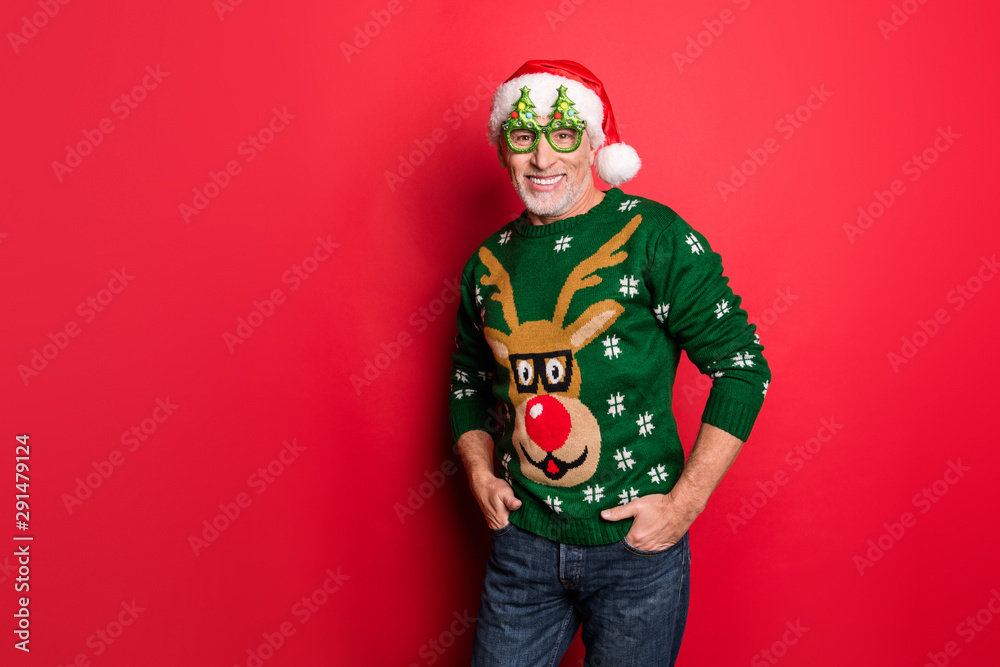 Where are you. Come with me on newyear party. Photo of excited positive cheerful in green pullover jeans mature granddad holding hands in pockets standing near copyspace isolated bright background Where are you. Come with me on newyear party. Photo of excited positive cheerful in green pullover jeans mature granddad holding hands in pockets standing near copyspace isolated bright background