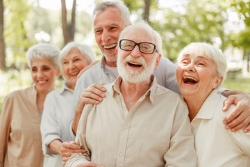 Cheerful old people standing on the street
