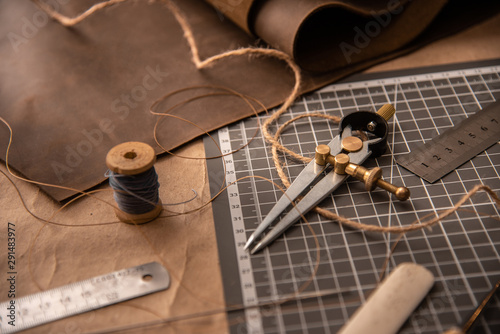 Leather craft tools on a cutting mat, workplace