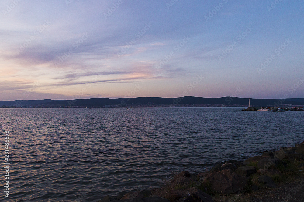 Obraz premium Twilight on the Black Sea coast. Mountains in the distance