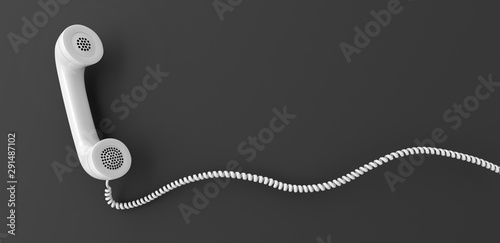 White retro telephone receiver flying in front of a gray backdrop with copy space - 3d illustration