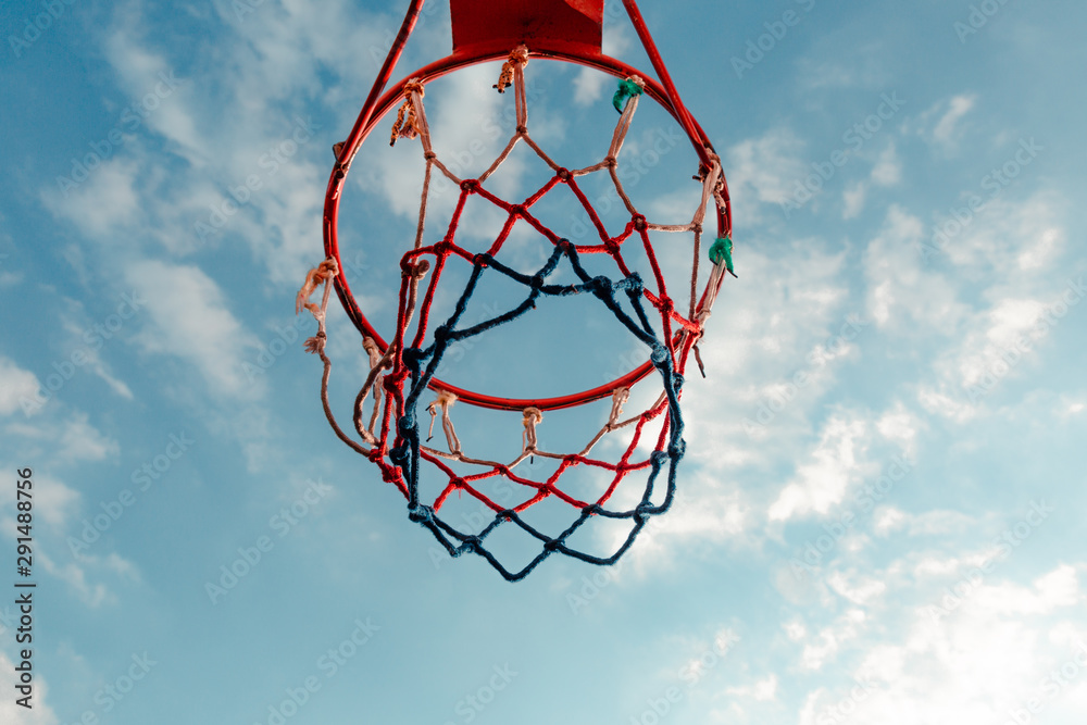 basketball hoop on background of blue sky