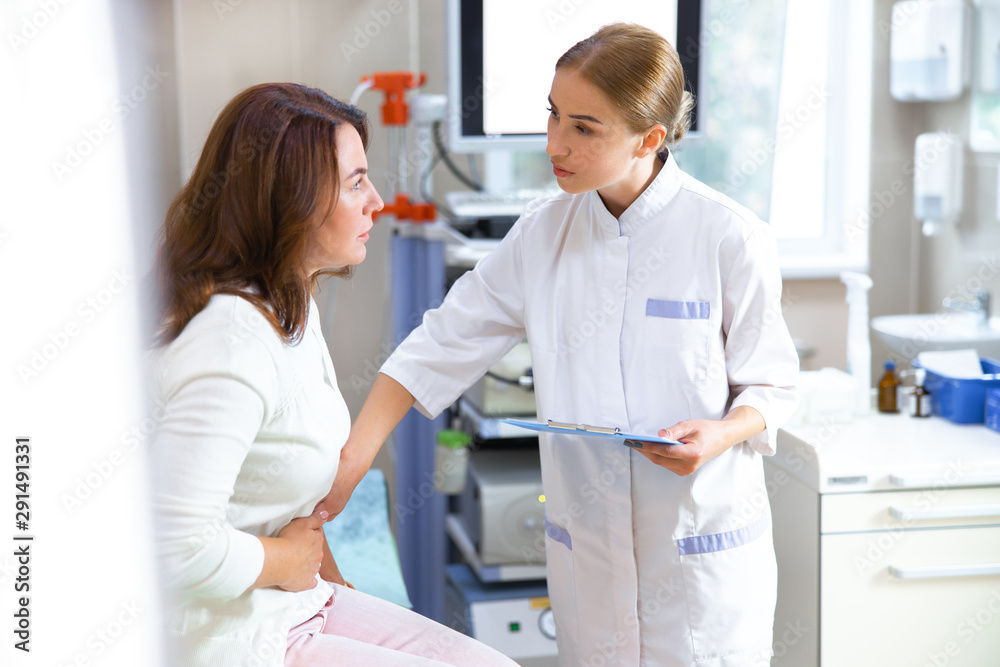 Fototapeta premium Woman visiting practitioner in hospital stock photo