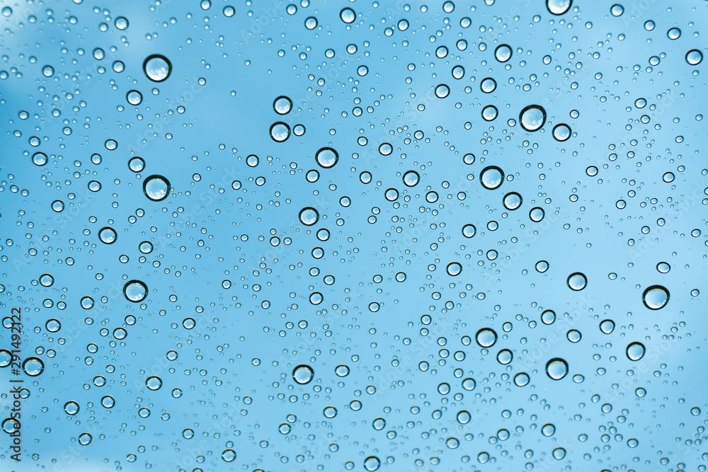 Rain on the window, natural skin of the rain The natural form of rainwater on a sky background. Rain on the window, natural skin of the rain The natural form of rainwater on a sky background.