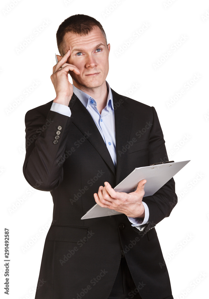 Thoughtful businessman holding note pad with pen in hand. Thoughtful businessman holding note pad with pen in hand.