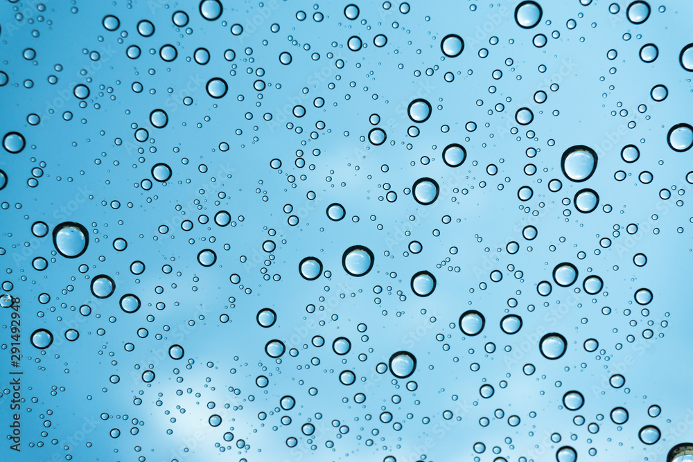 Rain on the window, natural skin of the rain The natural form of rainwater on a sky background. Rain on the window, natural skin of the rain The natural form of rainwater on a sky background.