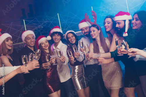 Portrait of nice-looking attractive shine glamorous diverse stylish cheerful positive girls and guys having fun festive feast festal evening nightlife in luxury place nightclub indoors