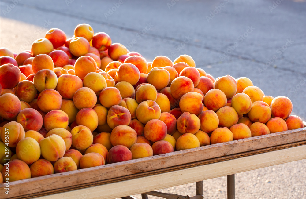 Fresh Picked Peaches and Apples at an Outdoor Market