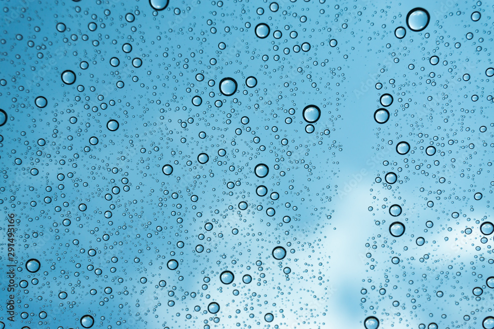 Rain on the window, natural skin of the rain The natural form of rainwater on a sky background. Rain on the window, natural skin of the rain The natural form of rainwater on a sky background.
