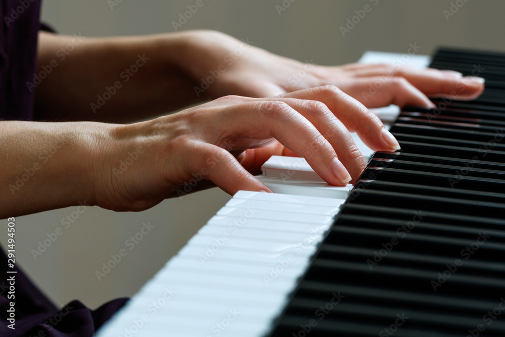 Young woman playing piano