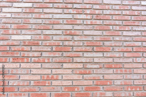 wall made of orange bricks. For texture or background