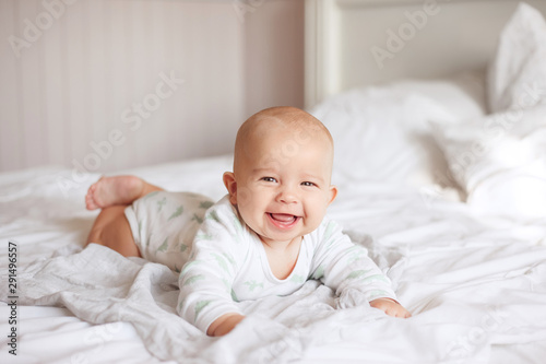 happy baby on the bed