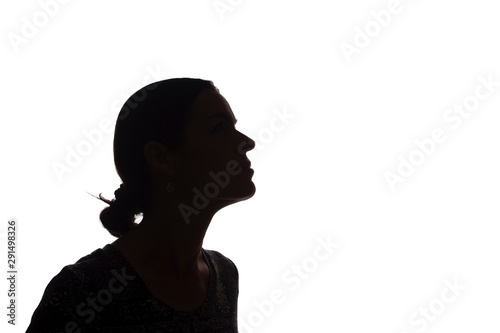 Portrait of young woman, pensive, thinking side view - silhouette, isolated