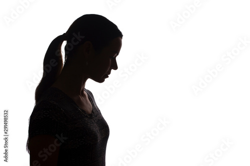 Silhouette of a young woman with problems