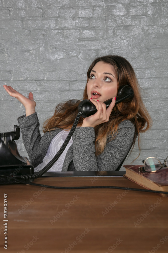 business woman negotiates over the phone, office situation business woman negotiates over the phone, office situation