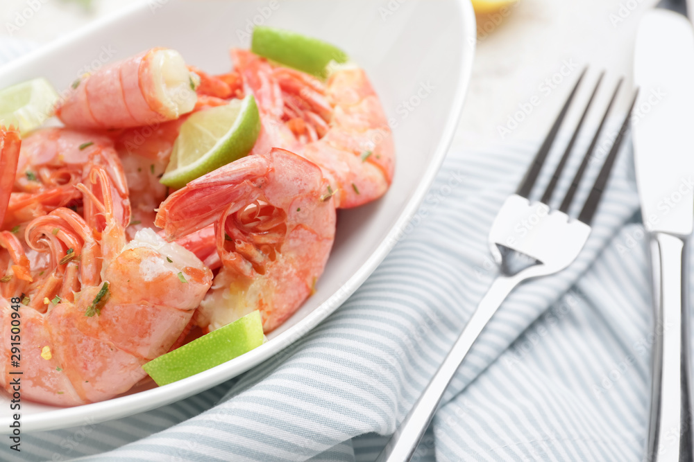 Plate with tasty shrimps on table Plate with tasty shrimps on table