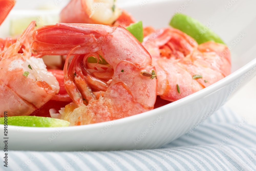 Plate with tasty shrimps on table, closeup Plate with tasty shrimps on table, closeup