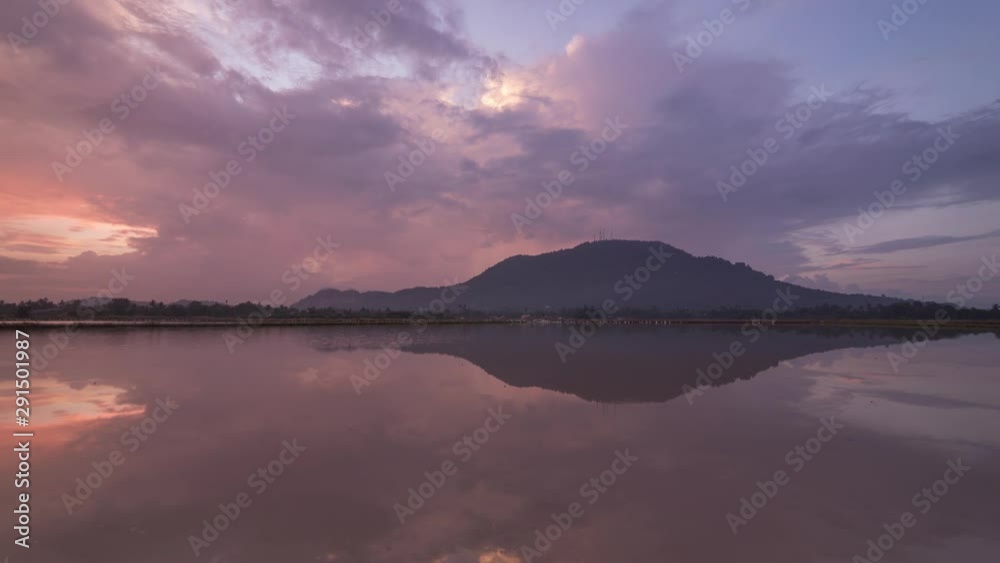 Timelapse sunrise reflection of Bukit Mertajam hill with egret bird flying around in the water search for food. Timelapse sunrise reflection of Bukit Mertajam hill with egret bird flying around in the water search for food.